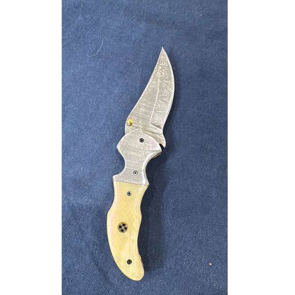 Pale handle curved knife